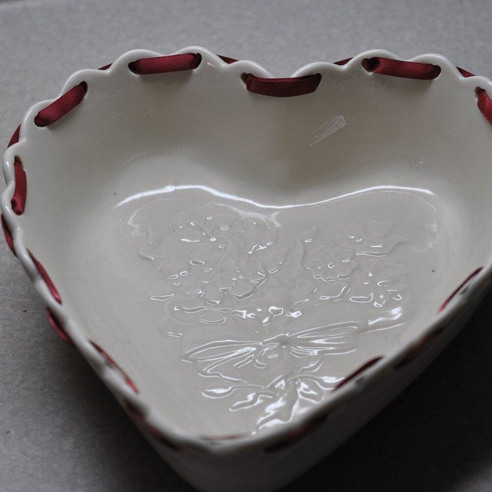 Longaberger pottery heart dish in cream with red ribbon